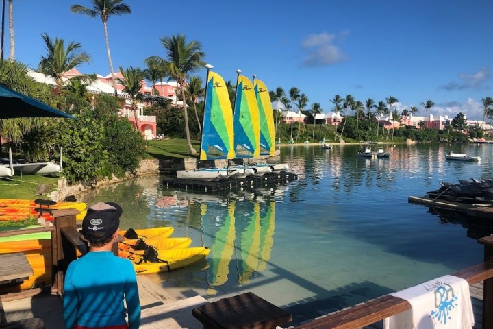 a boat that is sitting on a dock next to a body of water