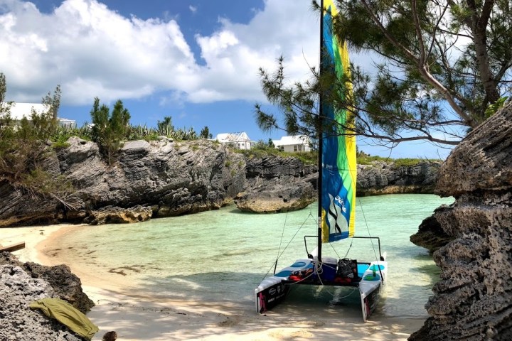 a boat that is sitting on a rock
