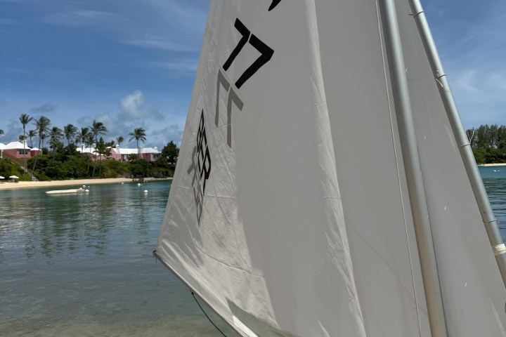 a close up of a boat next to a body of water