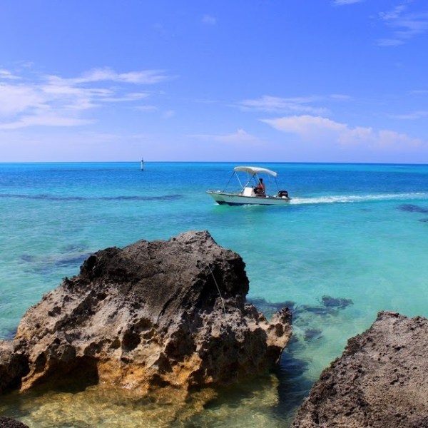 a rocky island in the middle of a body of water