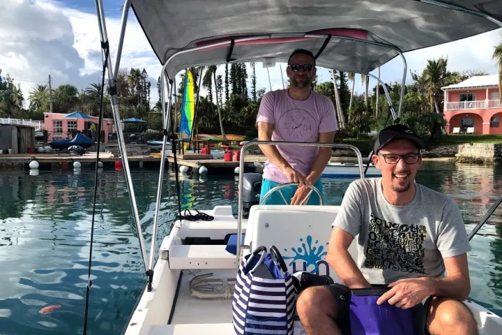 a man and a woman sitting on a boat