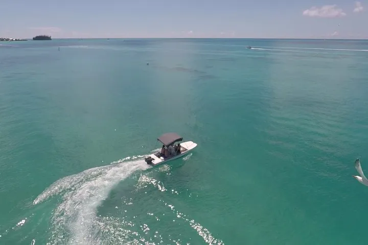 a man riding a wave on top of a body of water