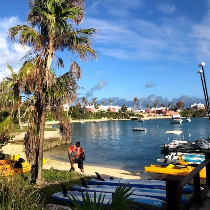 a boat sitting next to a body of water