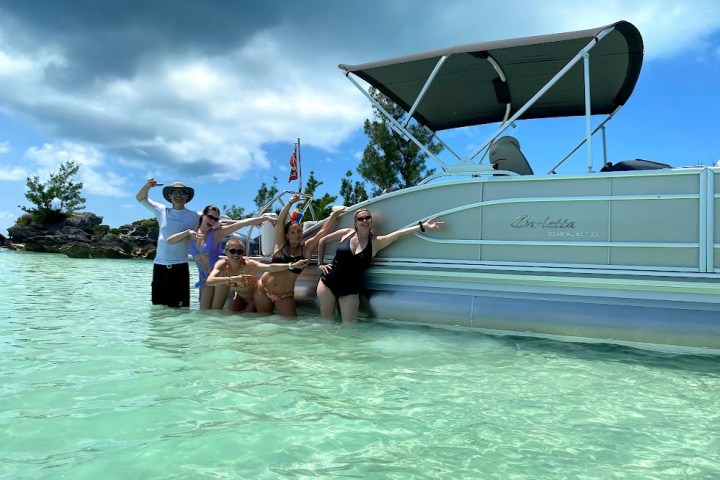 a group of people on a boat in the water